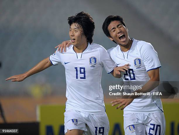 Bo Kyung Kim of Korea Republic is congratulated by team-mate Hee Seong Park after scoring the opening goal of the FIFA U20 World Cup Round of 16...