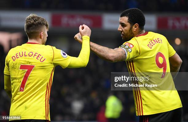 Gerard Deulofeu of Watford celebrates scoring the 3rd Watford goal with Troy Deeney during the Premier League match between Watford and Chelsea at...