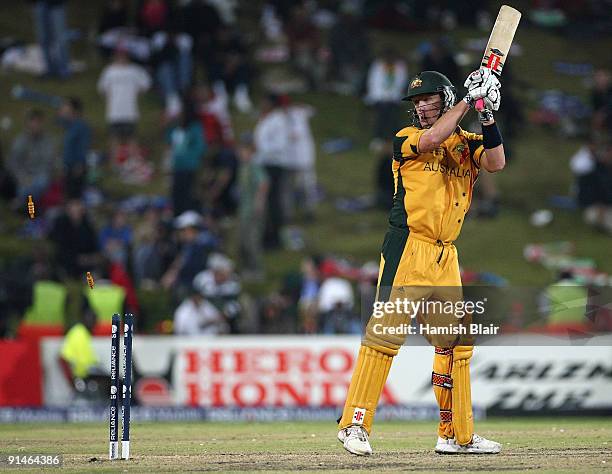 Cameron White of Australia is bowled offering no shot by Kyle Mills of New Zealand during the ICC Champions Trophy Final between Australia and New...