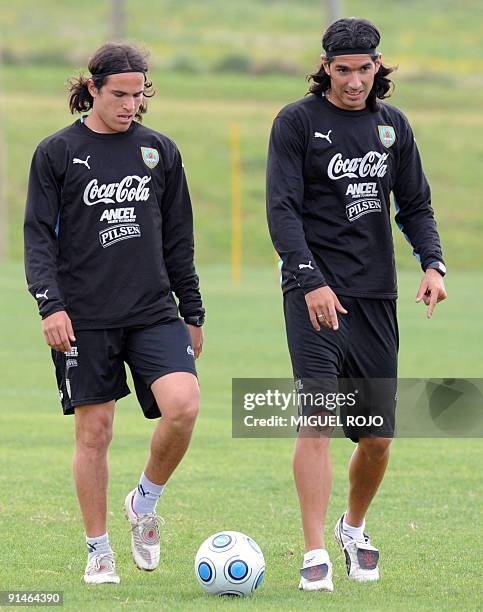 Uruguayan footballers Alvaro Gonzalez and Sebastian Abreu during a training session on October 05, 2009 in Montevideo. Uruguay will face Ecuador in...