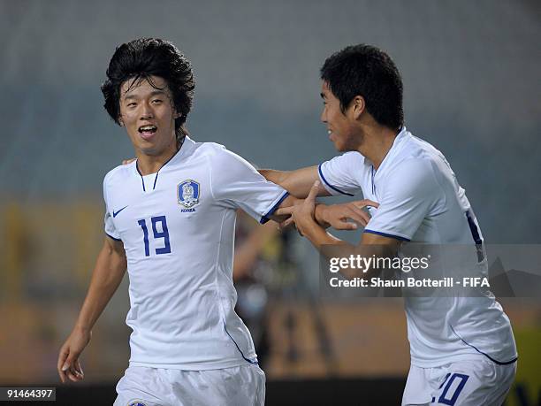 Bo Kyung Kim of Korea Republic is congratulated by team-mate Hee Seong Park after scoring the opening goal of the FIFA U20 World Cup Round of 16...