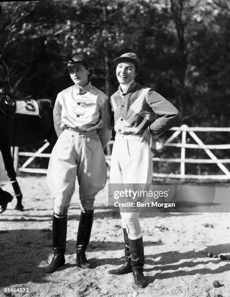 American socialites Gladys Hopkins Whitney, wife of Cornelius Vanderbilt Witney, and Mary Altemus Whitney , wife of John Hay Whitney, pose toegther,...