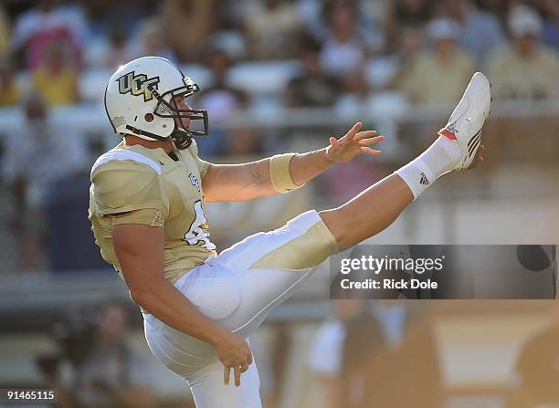 Punter Blake Clingan of the Central Florida Knights punts against the Memphis Tigers at Bright House Networks Stadium on October 3, 2009 in Orlando,...