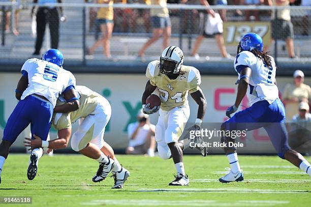 Tailback Brynn Harvey of the Central Florida Knights rushes against the Memphis Tigers at Bright House Networks Stadium on October 3, 2009 in...