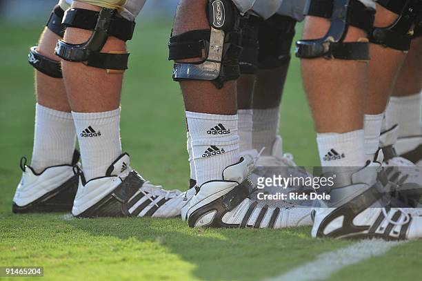 Detail view of knee braces and cleats of the Central Florida Knights linemen during the game against the Memphis Tigers at Bright House Networks...