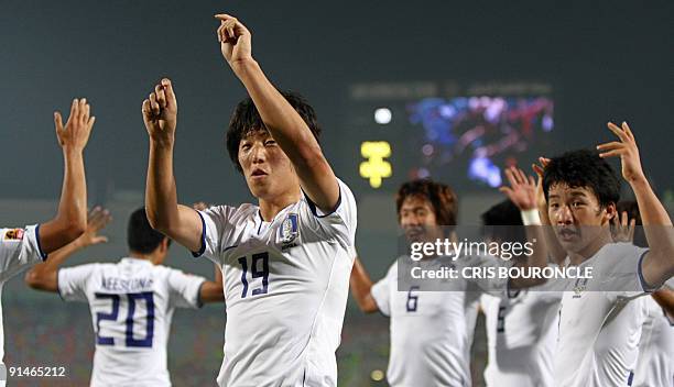 Members of the South Korean team celebrate the goal by forward Bo Kyung Kim , with him is also defense Min Woo Kim who also marked a goal during the...