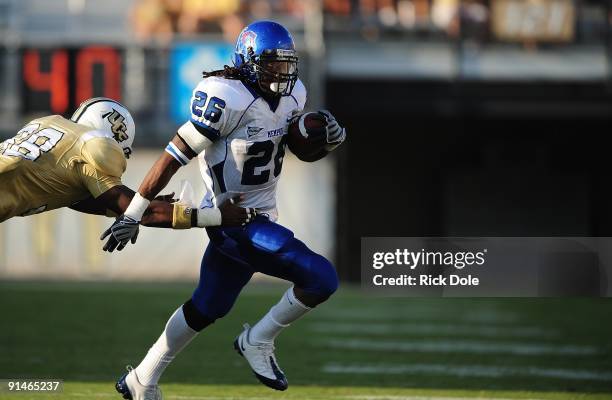 Running back Curtis Steele of the Memphis Tigers rushes against the Central Florida Knights at Bright House Networks Stadium on October 3, 2009 in...