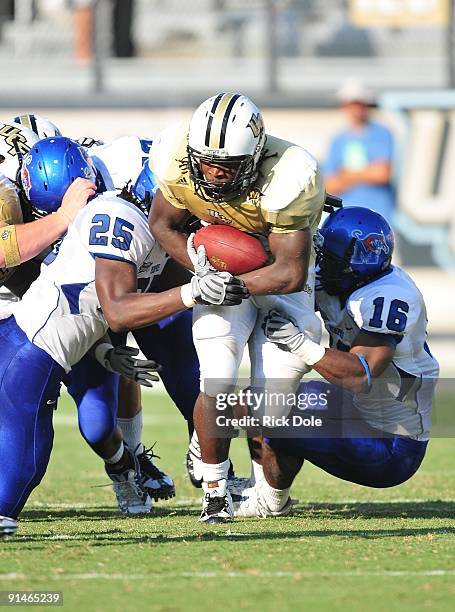 Tailback Brynn Harvey of the Central Florida Knights rushes against the Memphis Tigers at Bright House Networks Stadium on October 3, 2009 in...