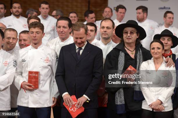 International director of the Michelin guide book Michael Ellis , chef Marc Veyrat Anne Sophie Pic pose with newly named France's three-stars,...