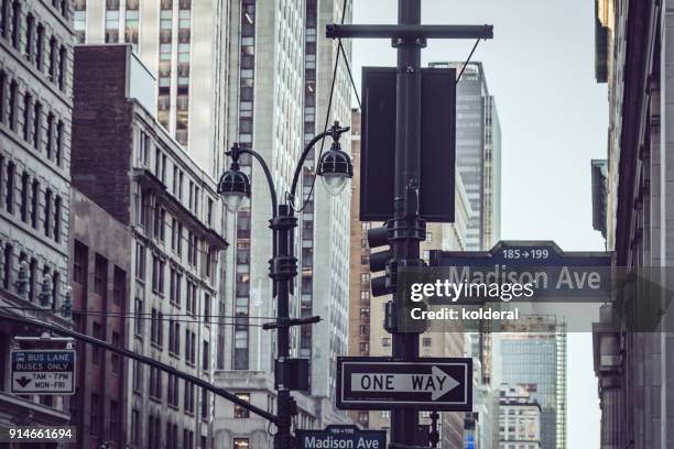 madison avenue directions signs. manhattan, new york - madison avenue photos et images de collection