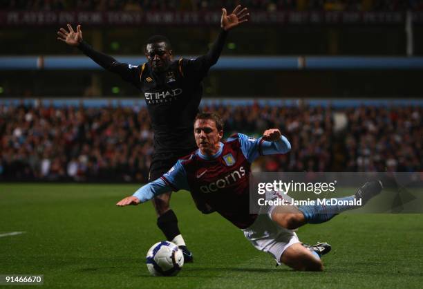 Stephen Warnock of Aston Villa tangles with Shaun Wright- Phillips of Manchester City during the Barclays Premier League match between Aston Villa...