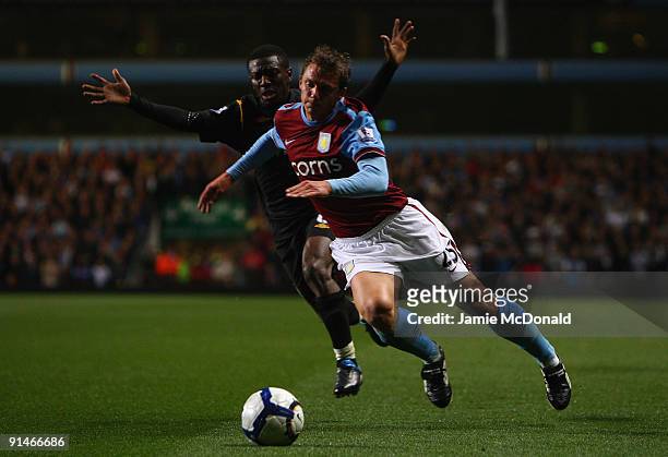 Stephen Warnock of Aston Villa tangles with Shaun Wright- Phillips of Manchester City during the Barclays Premier League match between Aston Villa...