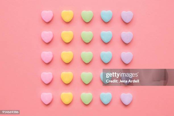 love hearts background valentine's day background with rainbow candy hearts - candy heart stock pictures, royalty-free photos & images