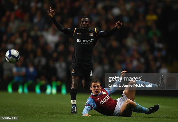 Stephen Warnock of Aston Villa tangles with Shaun Wright- Phillips of Manchester City during the Barclays Premier League match between Aston Villa...