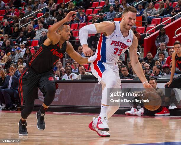 Blake Griffin of the Detroit Pistons drives to the basket in front of CJ McCollum of the Portland Trail Blazers during the an NBA game at Little...