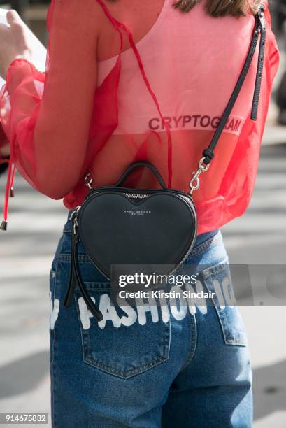 Fashion designer and founder of fashion label Anna K, Anna Karenina wears an Anna K blouse and jeans, Marc Jacobs bag day 5 of Paris Womens Fashion...