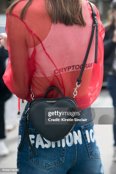 Fashion designer and founder of fashion label Anna K, Anna Karenina wears an Anna K blouse and jeans, Marc Jacobs bag day 5 of Paris Womens Fashion...