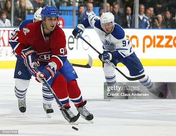 Scott Gomez of the Montreal Canadiens fires a pass in a game against the Toronto Maple Leafs on October 1, 2009 at the Air Canada Centre in Toronto,...