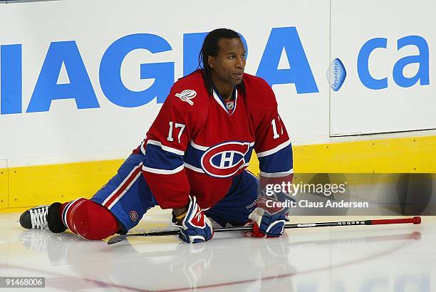 Georges Laraque of the Montreal Canadiens stretches in the warm-up prior to a game against the Toronto Maple Leafs on October 1, 2009 at the Air...