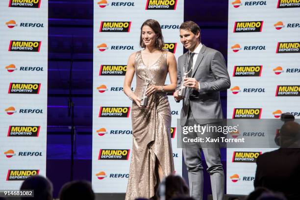 Garbiñe Muguruza and Rafael Nadal receive the best sportwoman and sportman of the year award during the 70th Mundo Deportivo Gala on February 5, 2018...