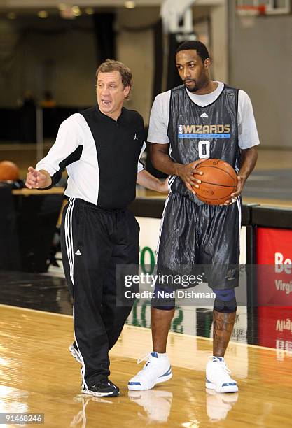 Head Coach Flip Saunders of the Washington Wizards speaks to Gilbert Arenas during the 2009 NBA Training Camp at the Siegel Center on the campus of...