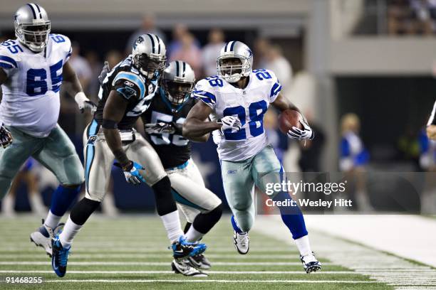 Felix Jones of the Dallas Cowboys runs with the ball against the Carolina Panthers at Cowboys Stadium on September 28, 2009 in Arlington, Texas. The...