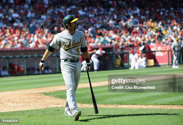 Nomar Garciaparra of the Oakland Athletics walks back to the dugout after striking out against the Los Angeles Angels of Anaheim at Angel Stadium of...