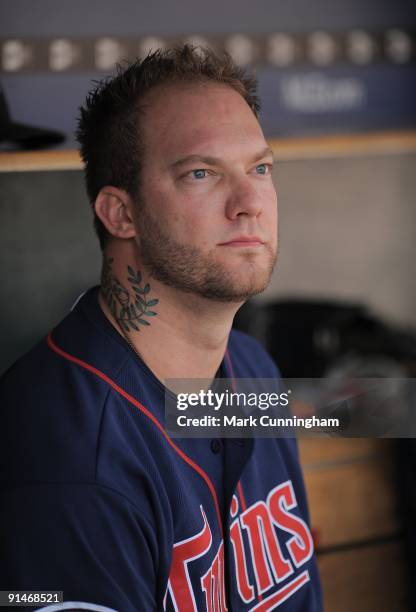 Jon Rauch of the Minnesota Twins looks on from the dugout against the Detroit Tigers during the game at Comerica Park on October 1, 2009 in Detroit,...