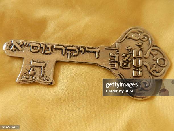 a key with kabbalistic script to protect from the evil eye, recto - kabbalah stock pictures, royalty-free photos & images