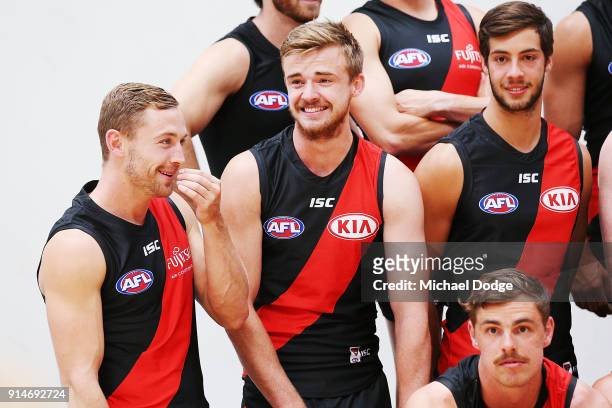 Debutant Devon Smith reacts with Martin Gleeson during an Essendon Bombers media session at The Hangar on February 6, 2018 in Melbourne, Australia.