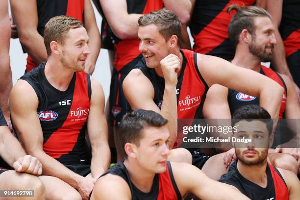 Debutant Devon Smith reacts with chats with Joe Daniher during an Essendon Bombers media session at The Hangar on February 6, 2018 in Melbourne,...