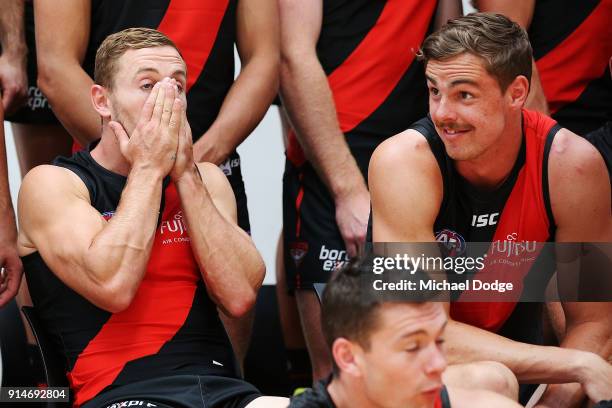 Debutant Devon Smith reacts with chats with Joe Daniher during an Essendon Bombers media session at The Hangar on February 6, 2018 in Melbourne,...