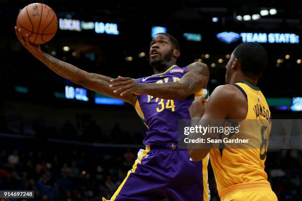 DeAndre Liggins of the New Orleans Pelicans shoots over Joe Johnson of the Utah Jazz during the second half at Smoothie King Center on February 5,...