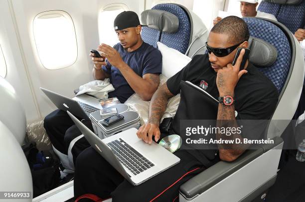 Carmelo Anthony and Dontaye Draper of the Denver Nuggets on plane for China for the NBA Games at Denver International Airport in Denver, Colorado....