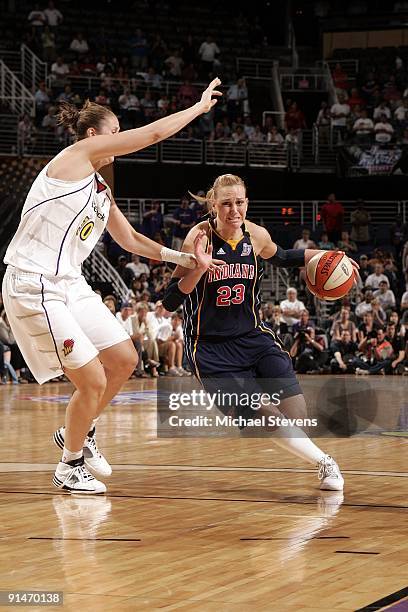 Katie Douglas of the Indiana Fever drives to the ball to tha basket against Nicole Ohlde of the Phoenix Mercury in Game one of the WNBA Finals during...