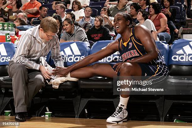 Ebony Hoffman of the Indiana Fever gets her ankle checked by athletic trainer Craig Stull in Game one of the WNBA Finals against the Phoenix Mercury...