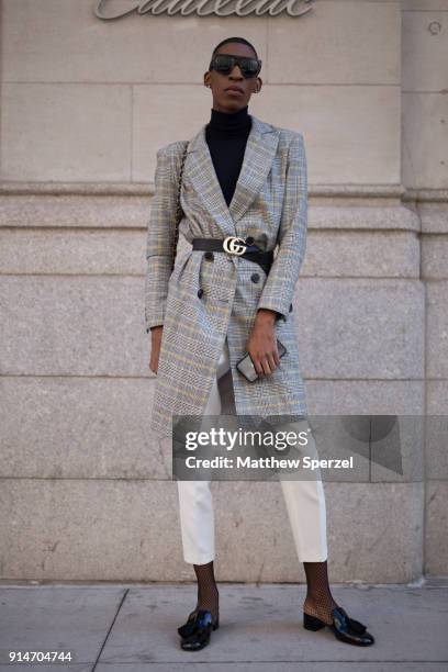 Guest is seen on the street attending Suitsupply during New York Fashion Week Men's wearing Gucci on February 5, 2018 in New York City.