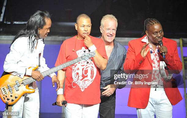 Bassist Verdine White and Ralph Johnson of Earth, Wind & Fire, trombonist James Pankow of Chicago and Philip Bailey of Earth, Wind and Fire perform...