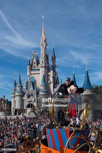 In this handout photo provided by Disney Resorts, Nick Foles of the Super Bowl LII winning team, the Philadelphia Eagles, celebrates at Walt Disney...