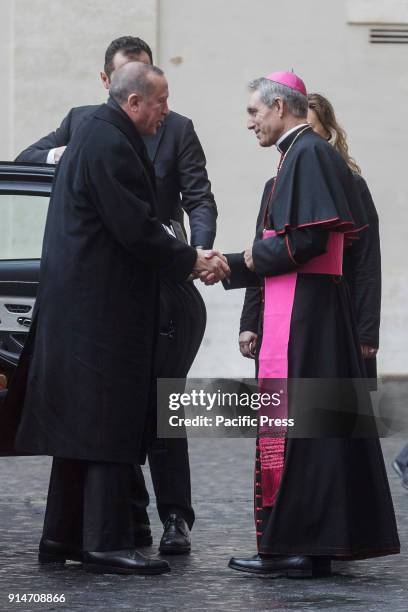 Turkey's President Recep Tayyip Erdogan is welcomed by Archbishop Georg Gaenswein, prefect of the Papal Household, upon his arrival at the Apostolic...