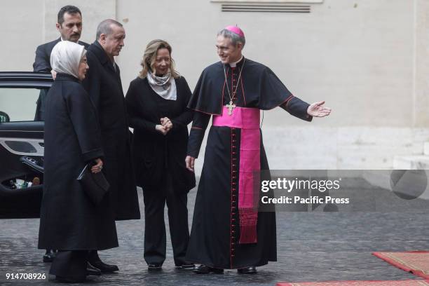 Turkey's President Recep Tayyip Erdogan and his wife Emine are welcomed by Archbishop Georg Gaenswein, prefect of the Papal Household, upon his...