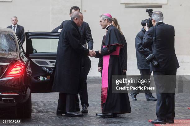 Turkey's President Recep Tayyip Erdogan is welcomed by Archbishop Georg Gaenswein, prefect of the Papal Household, upon his arrival at the Apostolic...