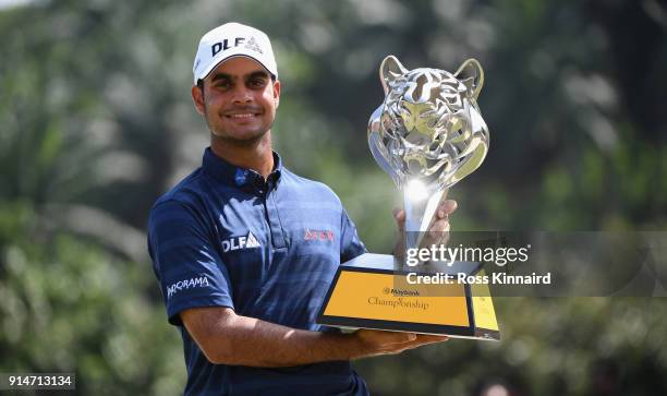 Shubhankar Sharma of India poses with the trophy after winning the Maybank Championship Malaysia at Saujana Golf and Country Club on February 4, 2018...