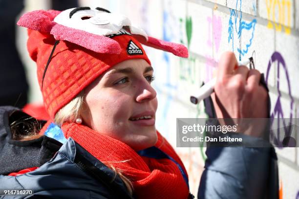 Annika Drazek of Germany team signs the Truce Wall after the team's flag raising ceremony during previews ahead of the PyeongChang 2018 Winter...