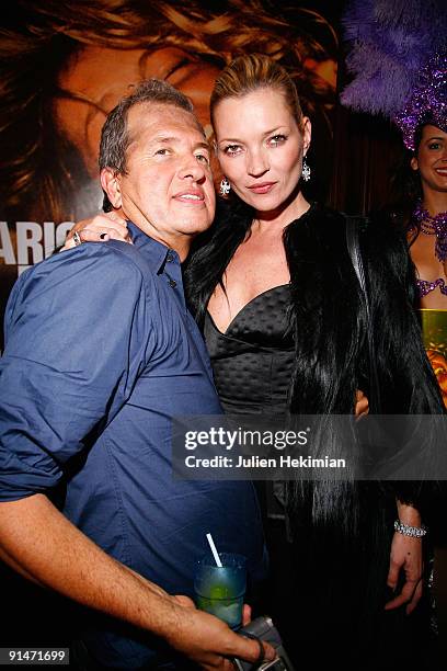 Mario Testino and Kate Moss attend the 'Mario de Janeiro Testino' book launch at Cafe Carmen on October 5, 2009 in Paris, France.