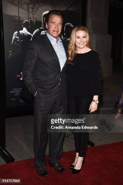 Actor Arnold Schwarzenegger and Heather Milligan arrive at the premiere of Warner Bros. Pictures' "The 15:17 To Paris" at Warner Bros. Studios on...