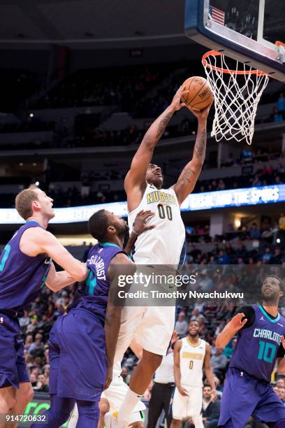 Darrell Arthur of the Denver Nuggets drives to the basket for a slam dunk against the Charlotte Hornets at the Pepsi Center on February 5, 2018 in...