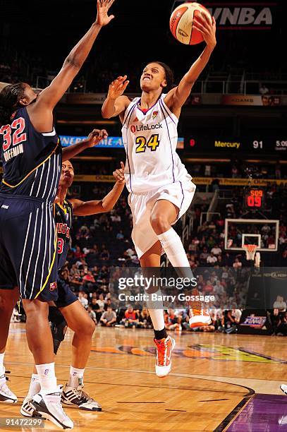 DeWanna Bonner of the Phoenix Mercury goes up for a shot against Ebony Hoffman of the Indiana Fever in Game one of the WNBA Finals during the 2009...