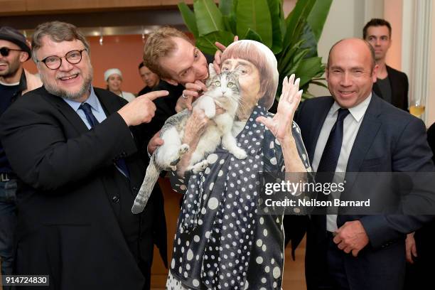 Guillermo del Toro, Doug Jones, and J. Miles Dale pose with a cutout of French filmmaker Agnes Varda during The Hollywood Reporter 6th Annual...