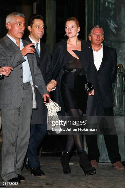 Kate Moss and Jamie Hince leave the Yves Saint Laurent Pret a Porter show as part of the Paris Womenswear Fashion Week Spring/Summer 2010 on October...
